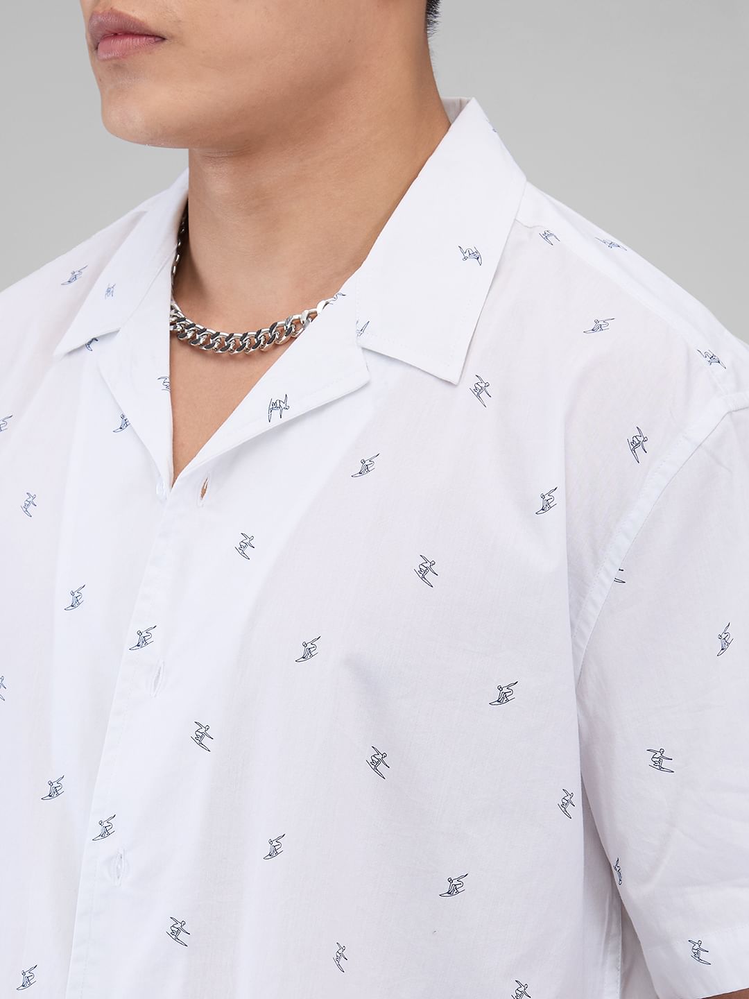 Quirky White Tiny Skiing Printed Oversized Shirt